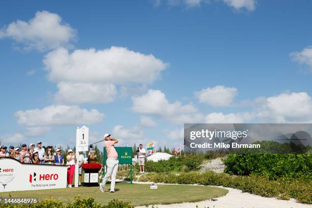 Scottie Scheffler of the United States plays his shot from the first tee during the final round Hero World Challenge at Albany Golf Course on...