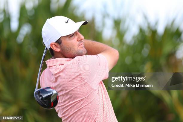 Scottie Scheffler of the United States plays his shot from the fourth tee during the final round Hero World Challenge at Albany Golf Course on...