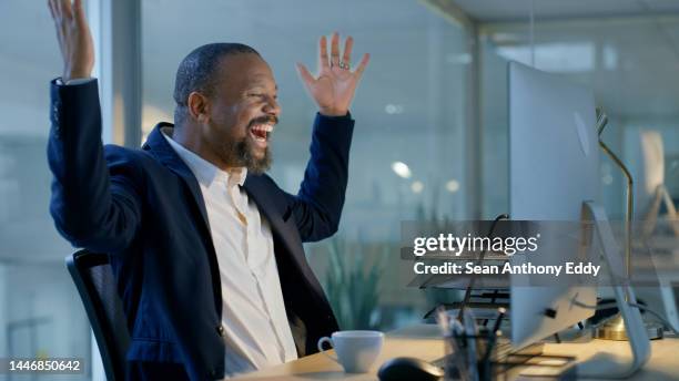 black man, computer and celebration for promotion email, success and wow for bonus, happy smile and surprise in office. businessman celebrate, surprise and happiness for good news or winner at night - good news icon stock pictures, royalty-free photos & images