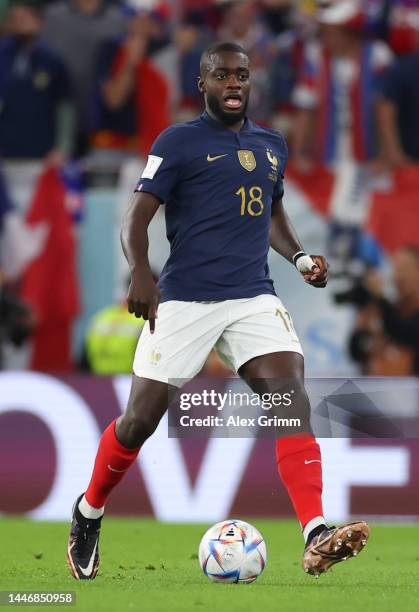 Dayot Upamecano of France controls the ball during the FIFA World Cup Qatar 2022 Round of 16 match between France and Poland at Al Thumama Stadium on...