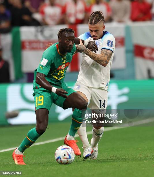Famara Diédhiou of Senegal vies with Kalvin Phillips of England during the FIFA World Cup Qatar 2022 Round of 16 match between England and Senegal at...