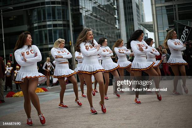 Cheerleaders of the University Of Southern California Trojan Band perform at Canary Wharf on May 17, 2012 in London, England. This is the first visit...