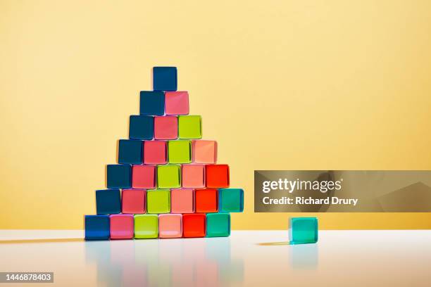 conceptual image of acrylic glass cubes - achievement gap stock pictures, royalty-free photos & images