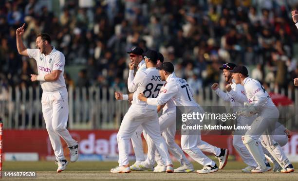 Ollie Robinson of England celebrates dismissing Agha Salman of England during day five of the First Test Match between Pakistan and England at...