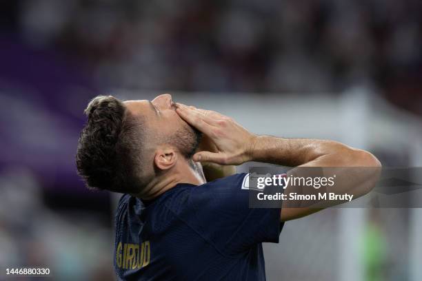 Olivier Giroud of France looks to the sky as he celebrates scoring a goal during the FIFA World Cup Qatar 2022 Round of 16 match between France and...