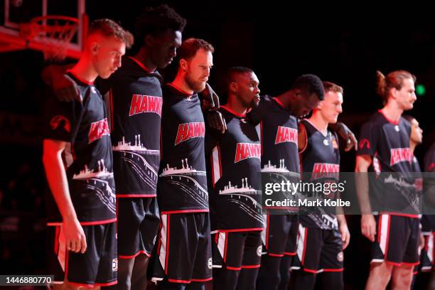 The Hawks team stand for a moment of silence before play during the round 9 NBL match between the Illawarra Hawks and Melbourne United at WIN...