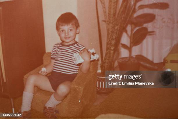 portrait of a boy playing with his car toy - 20th century model car stock pictures, royalty-free photos & images