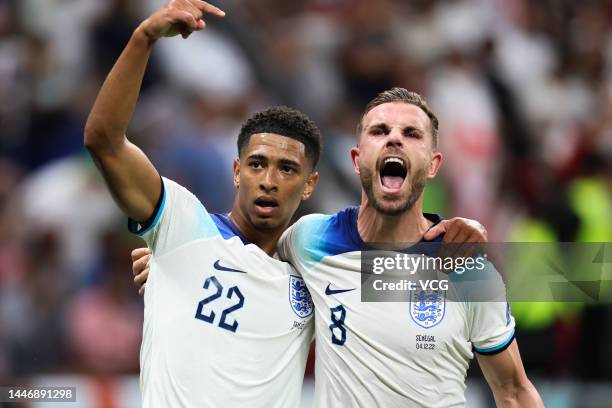 Jordan Henderson of England celebrates a goal with Jude Bellingham of England during the FIFA World Cup Qatar 2022 Round of 16 match between England...