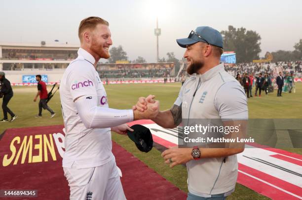 Ben Stokes of England celebrates with coach Brendon McCullum after winning the First Test Match between Pakistan and England at Rawalpindi Cricket...