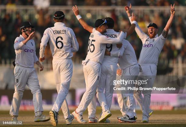 Ben Stokes of England celebrates after James Anderson dismissed Zahid Mahmood of Pakistan during the fifth day of the first Test between Pakistan and...