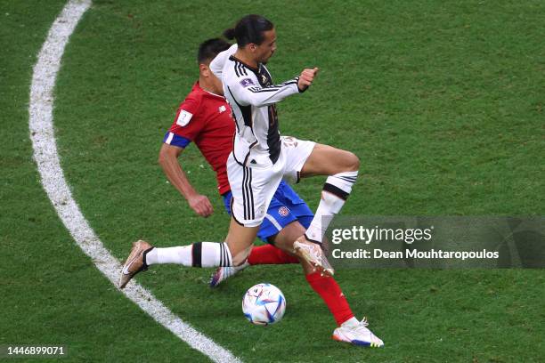 Serge Gnabry of Germany battles for possession with Bryan Oviedo of Costa Rica during the FIFA World Cup Qatar 2022 Group E match between Costa Rica...