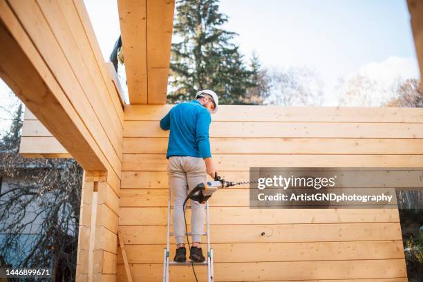 worker on the construction site. - handyman stock pictures, royalty-free photos & images