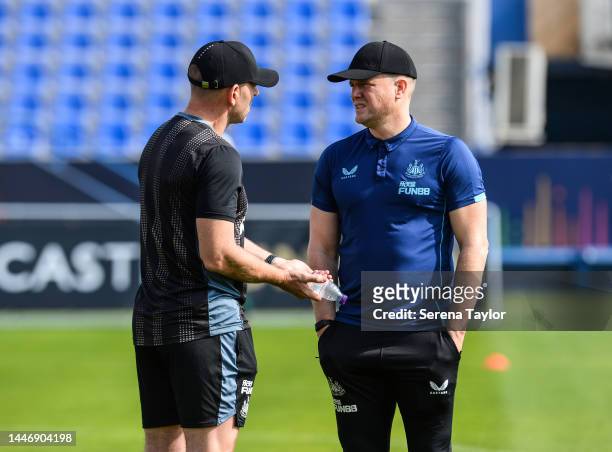 Newcastle United Head Coach Eddie Howe speaks with Graeme Jones during the Newcastle United Training Session at the Al Hilal FC Training Centre on...