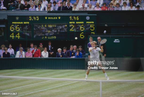 John Lloyd from Great Britain plays a backhand return to Scott Davis of the United States during their Men's Singles Third Round match at the...