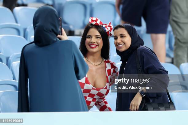 Ivana Knoll, former Miss Croatia poses for a photo with the fans prior to the FIFA World Cup Qatar 2022 Round of 16 match between Japan and Croatia...