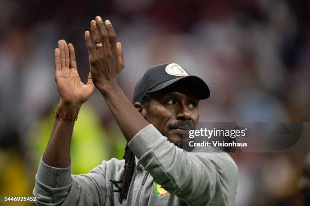 Senegal Head Coach Aliou Cisse ackowledges the Senegal fans after the FIFA World Cup Qatar 2022 Round of 16 match between England and Senegal at Al...