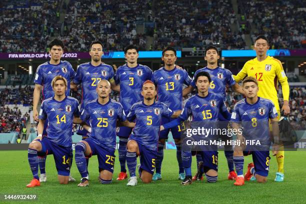 Japan players line up for team photos prior to the FIFA World Cup Qatar 2022 Round of 16 match between Japan and Croatia at Al Janoub Stadium on...