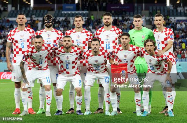 Croatia players line up for team photos prior to the FIFA World Cup Qatar 2022 Round of 16 match between Japan and Croatia at Al Janoub Stadium on...