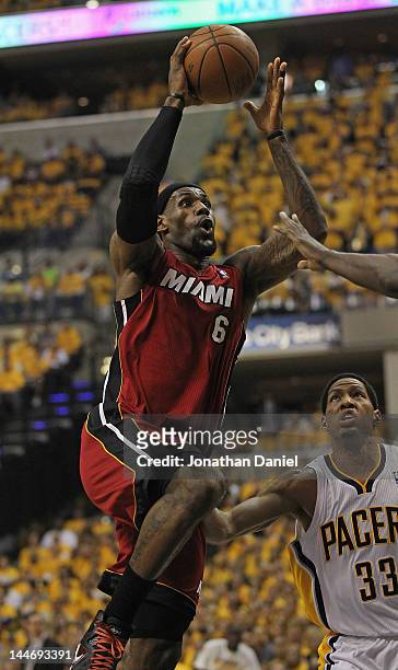 LeBron James of the Miami Heat goes up for a shot over Danny Granger of the Indiana Pacers in Game Three of the Eastern Conference Semifinals in the...