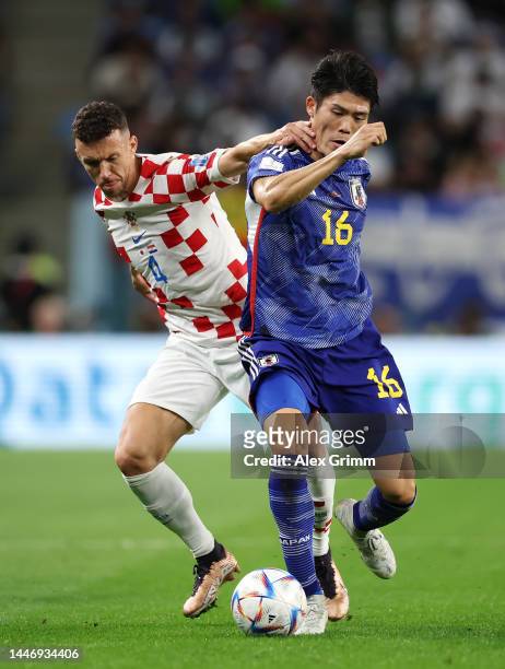Ivan Perisic of Croatia battles for possession with Takehiro Tomiyasu of Japan during the FIFA World Cup Qatar 2022 Round of 16 match between Japan...
