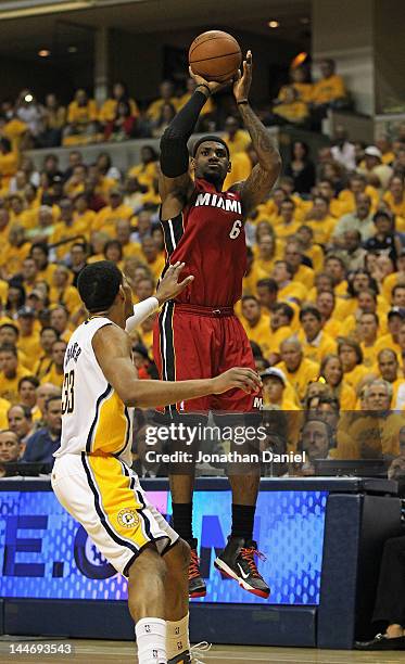 LeBron James of the Miami Heat shoots over Danny Granger of the Indiana Pacers in Game Three of the Eastern Conference Semifinals in the 2012 NBA...