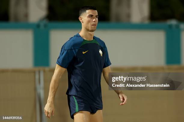Cristiano Ronaldo of Portugal looks on during the Portugal Training Sesion on match day -1 at Al Shahaniya SC training site on December 05, 2022 in...