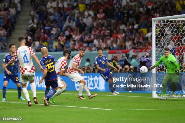 Daizen Maeda of Japan scores the team's first goal during the FIFA World Cup Qatar 2022 Round of 16 match between Japan and Croatia at Al Janoub...