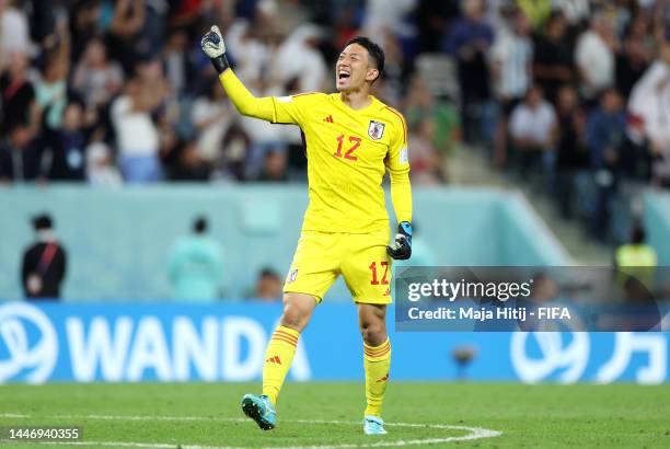 Shuichi Gonda of Japan celebrates their first goal by Daizen Maeda during the FIFA World Cup Qatar 2022 Round of 16 match between Japan and Croatia...