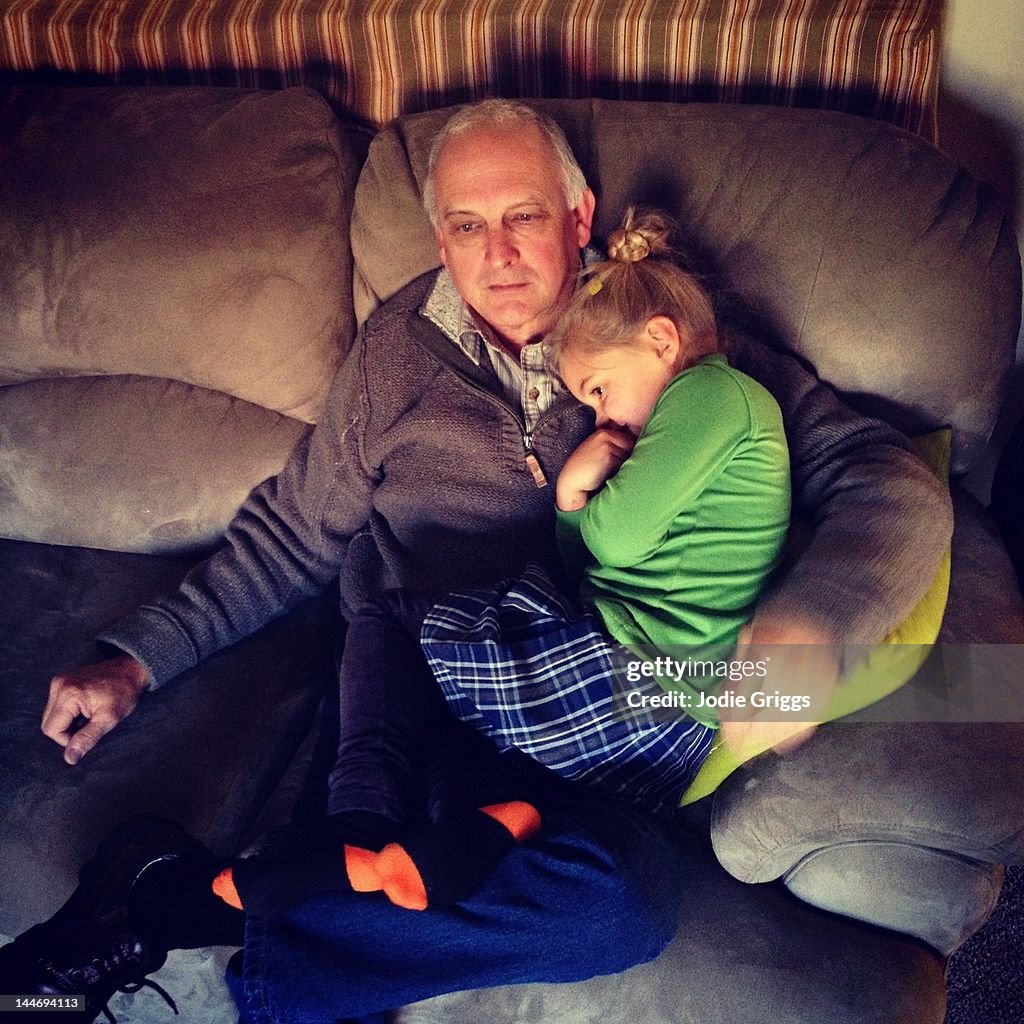 Grandfather and Grandchild having cuddle