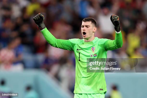 Dominik Livakovic of Croatia celebrates after the first goal by Ivan Perisic during the FIFA World Cup Qatar 2022 Round of 16 match between Japan and...