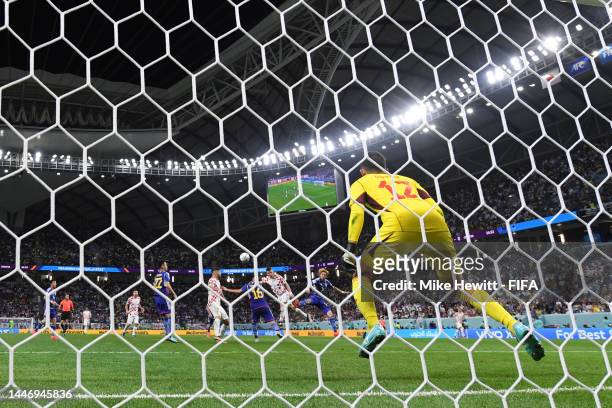 Ivan Perisic of Croatia scores the team's first goal past Shuichi Gonda of Japan during the FIFA World Cup Qatar 2022 Round of 16 match between Japan...