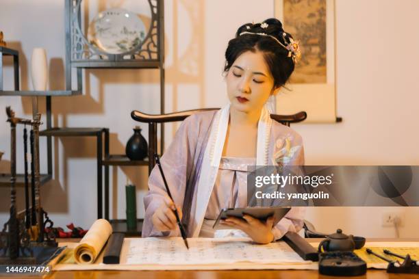 asian hanfu beauties use tablet computers to draw with brushes - paint microsoft stock pictures, royalty-free photos & images