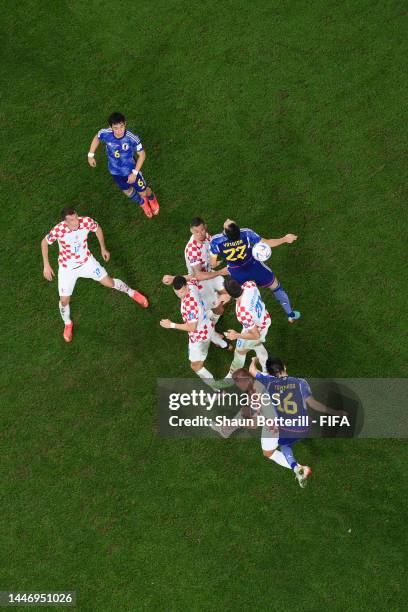 Maya Yoshida of Japan heads the ball against Dejan Lovren of Croatia during the FIFA World Cup Qatar 2022 Round of 16 match between Japan and Croatia...