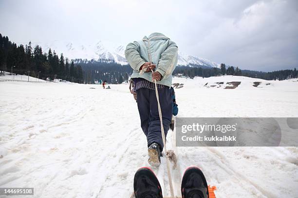 sledge by man - baramulla district stockfoto's en -beelden