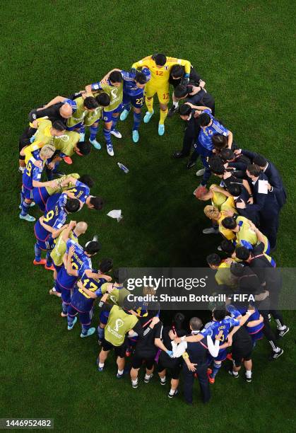 Japan players huddle before extra time during the FIFA World Cup Qatar 2022 Round of 16 match between Japan and Croatia at Al Janoub Stadium on...