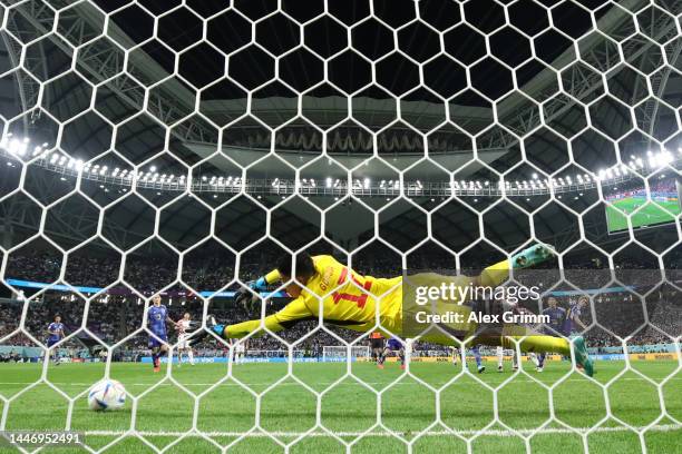 Ivan Perisic of Croatia scores the team's first goal past Shuichi Gonda of Japan during the FIFA World Cup Qatar 2022 Round of 16 match between Japan...