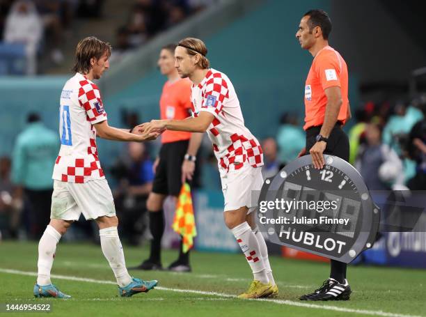 Lovro Majer replaces Luka Modric of Croatia during the FIFA World Cup Qatar 2022 Round of 16 match between Japan and Croatia at Al Janoub Stadium on...
