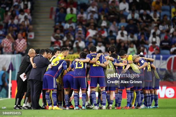 Japan players huddle before the second half of extra time during the FIFA World Cup Qatar 2022 Round of 16 match between Japan and Croatia at Al...