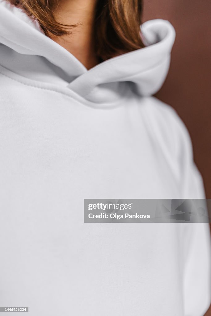 Long-haired man dressed in a white hoodie, mockup
