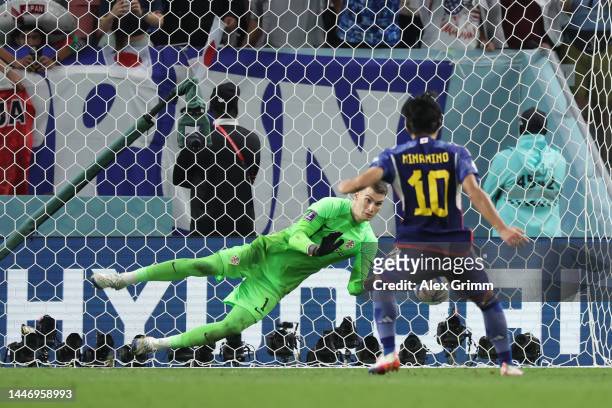 Dominik Livakovic of Croatia saves the first penalty from Takumi Minamino of Japan in the penalty shoot out during the FIFA World Cup Qatar 2022...