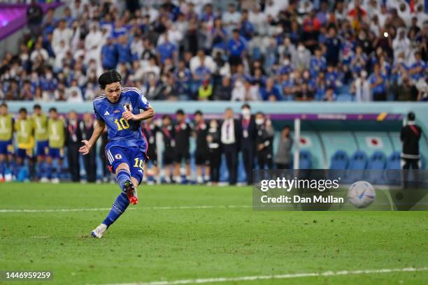 Takumi Minamino of Japan shoots the team's first penalty saved by Dominik Livakovic of Croatia in the penalty shoot out during the FIFA World Cup...