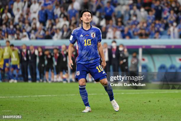 Takumi Minamino of Japan reacts after their sides first penalty was saved during the FIFA World Cup Qatar 2022 Round of 16 match between Japan and...