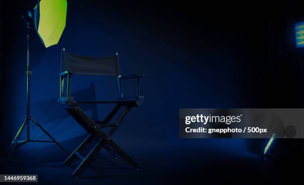 director chair with cinema lightbox sign director text on it and clapperboard megaphone,bangkok,thailand - 映画撮影法 ストックフォトと画像