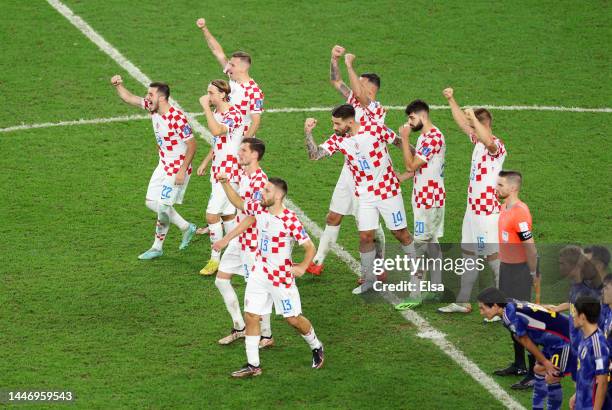 Croatia players react after Dominik Livakovic of Croatia saves a penalty during the FIFA World Cup Qatar 2022 Round of 16 match between Japan and...