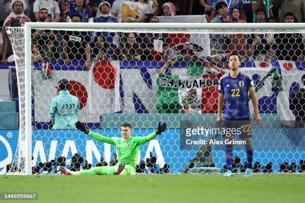 Dominik Livakovic of Croatia reacts after saving Japan's fourth penalty during the FIFA World Cup Qatar 2022 Round of 16 match between Japan and...