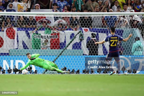 Dominik Livakovic of Croatia saves the fourth penalty from Maya Yoshida of Japan in the penalty shoot out during the FIFA World Cup Qatar 2022 Round...