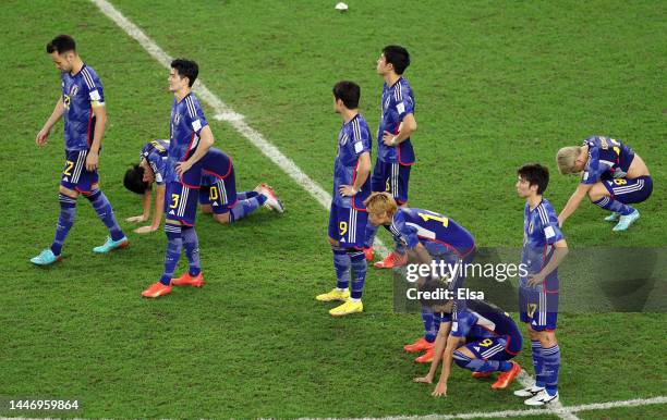 Japan players show dejection after their defeat through the penalty shootout during the FIFA World Cup Qatar 2022 Round of 16 match between Japan and...