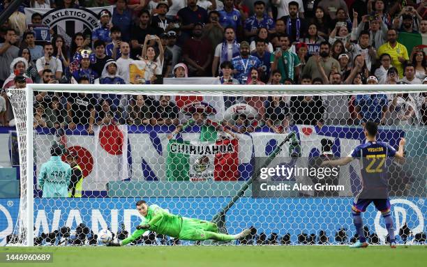 Dominik Livakovic of Croatia saves the fourth penalty by Maya Yoshida of Japan in the penalty shoot out during the FIFA World Cup Qatar 2022 Round of...