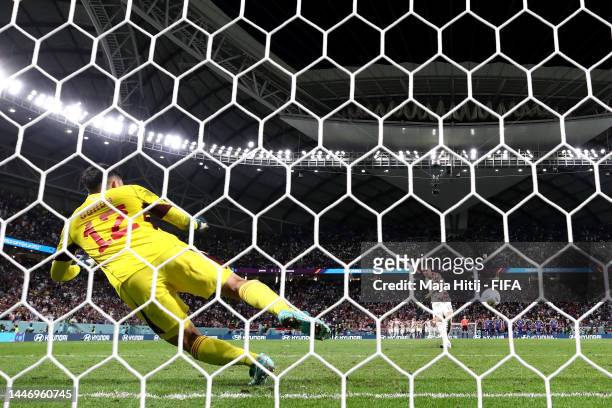 Mario Pasalic of Croatia scores the sides winning penalty in the penalty shoot out past Shuichi Gonda of Japan during the FIFA World Cup Qatar 2022...