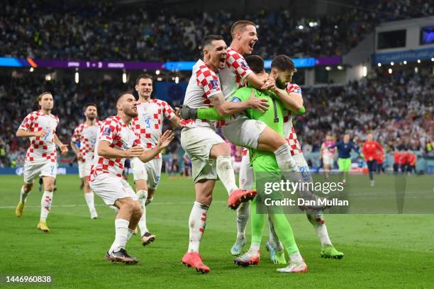 Croatia players celebrate after winning the penalty shoot out during the FIFA World Cup Qatar 2022 Round of 16 match between Japan and Croatia at Al...